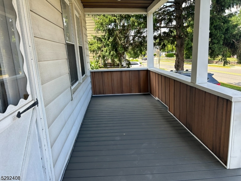 136 Carlton Avenue, Unit 1 East Rutherford, NJ 07073 - Photo 13 of 16 a view of a balcony with wooden floor