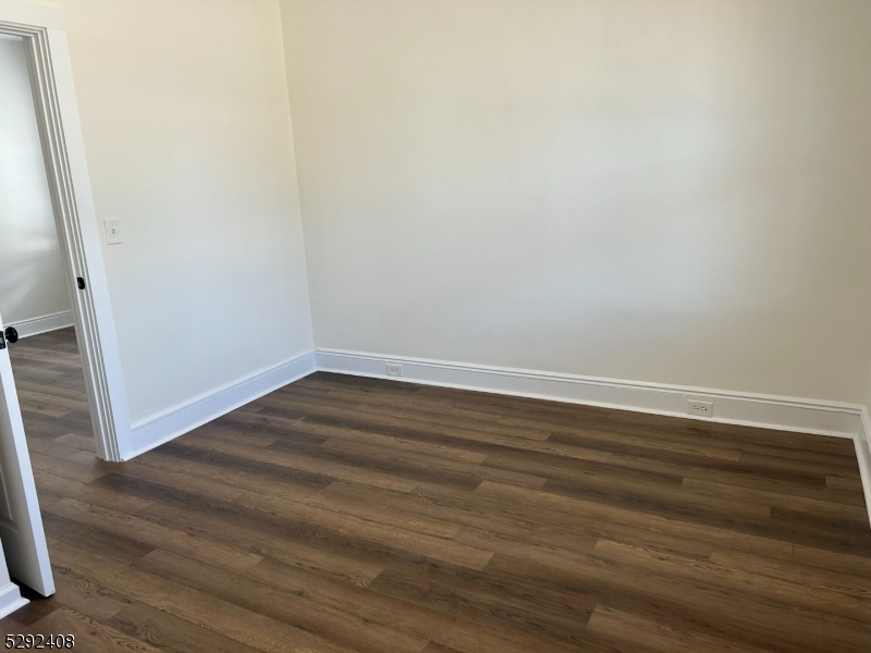 136 Carlton Avenue, Unit 1 East Rutherford, NJ 07073 - Photo 7 of 16 a view of a room with wooden floor