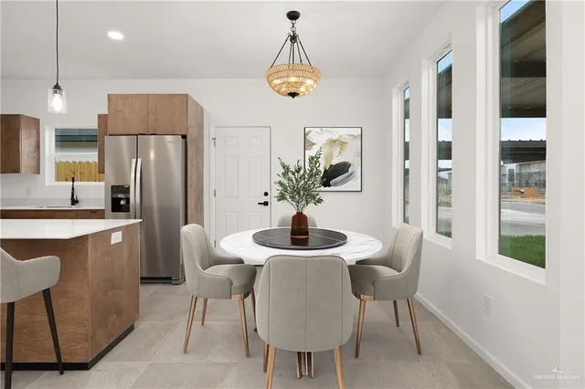 a dining room with furniture and window