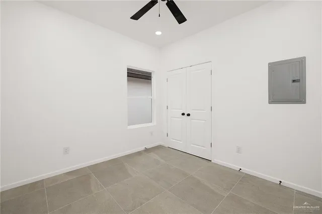 an empty room with view of a bathroom