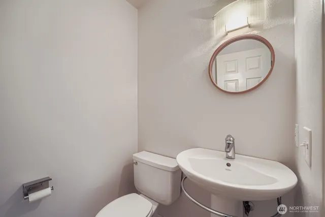 a bathroom with a toilet and a sink