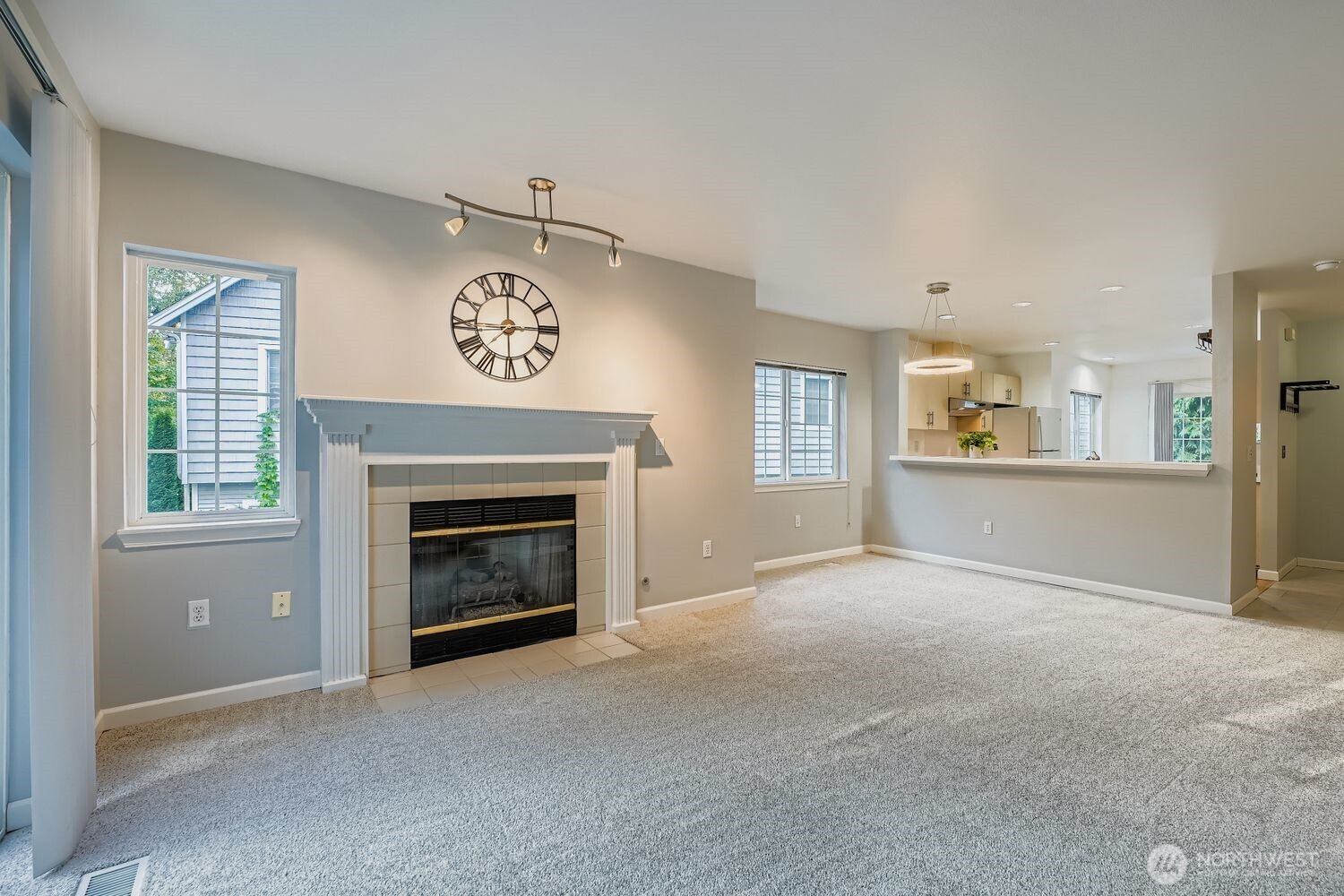 601 12th Avenue Northwest, Unit C1 Issaquah, WA 98027 - Photo 6 of 28 a view of a livingroom with a fireplace and window