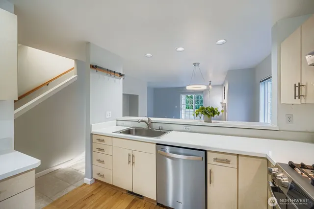 a kitchen with a sink and cabinets