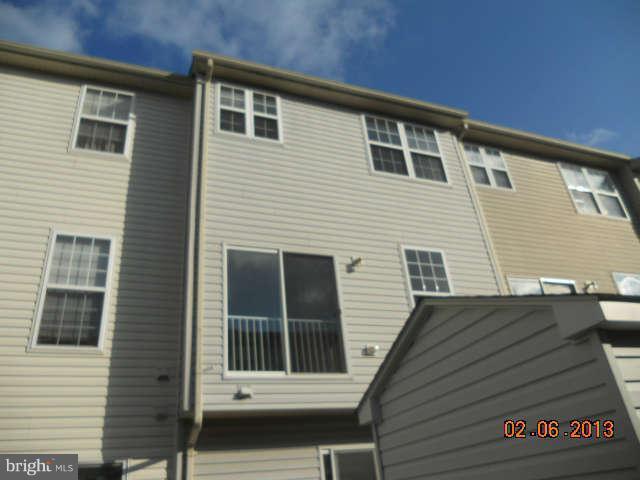 636 Luthardt Road Baltimore, MD 21220 - Photo 11 of 11 a view of a house with more windows and brick walls
