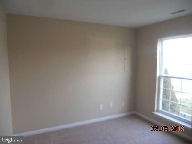 636 Luthardt Road Baltimore, MD 21220 - Photo 5 of 11 an empty room with a window