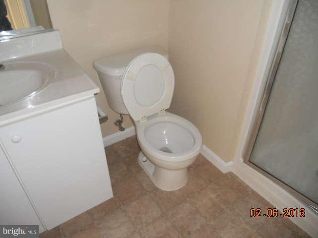 636 Luthardt Road Baltimore, MD 21220 - Photo 6 of 11 a white toilet sitting next to a sink