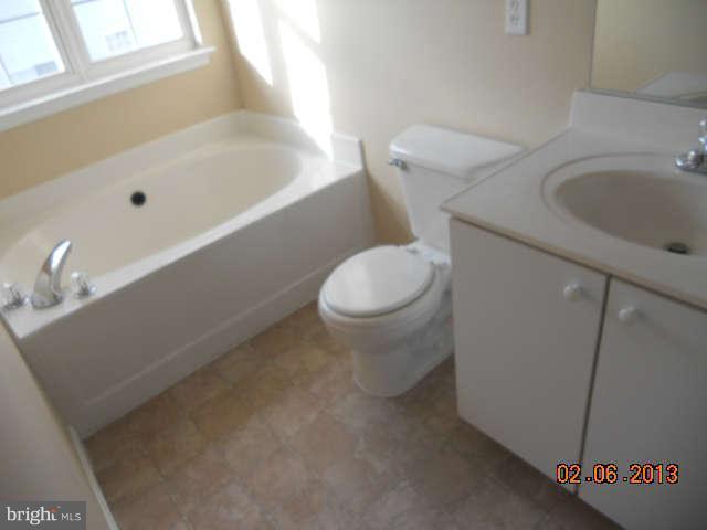 636 Luthardt Road Baltimore, MD 21220 - Photo 9 of 11 a bathroom with a sink and a toilet
