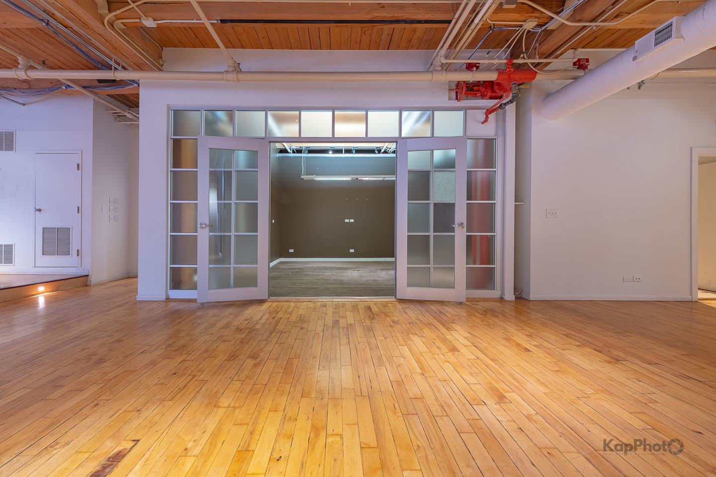 913 West Van Buren Street, Unit 1A Chicago, IL 60607 - Photo 13 of 45 a view of a hallway with wooden floor
