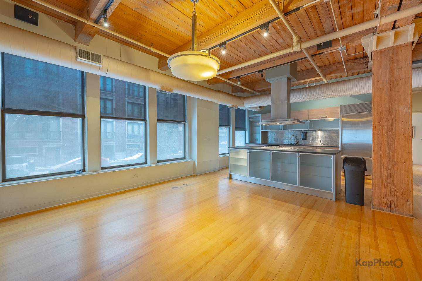 913 West Van Buren Street, Unit 1A Chicago, IL 60607 - Photo 16 of 45 a view of kitchen with stainless steel appliances wooden floor and empty room