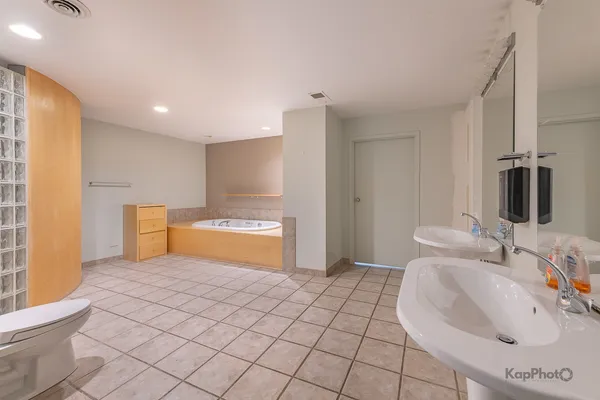 a bathroom with a sink a toilet and a tub