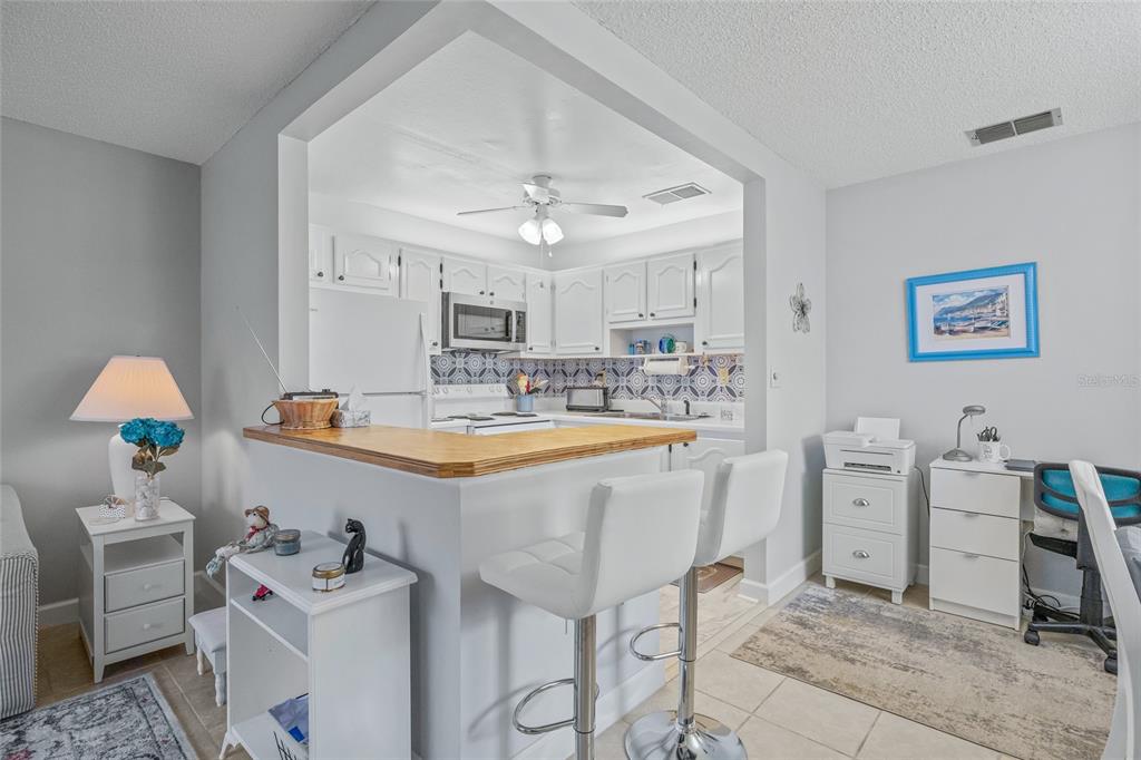 11923 Boynton Lane, Unit B New Port Richey, FL 34654 - Photo 11 of 34 a spacious bathroom with a sink double vanity and a tub