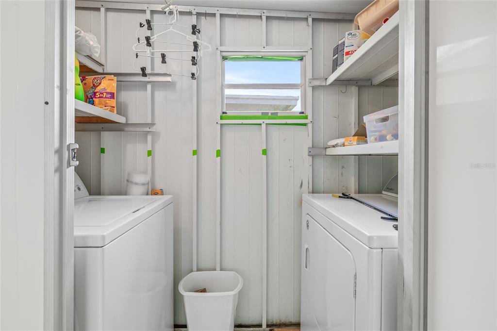 11923 Boynton Lane, Unit B New Port Richey, FL 34654 - Photo 24 of 34 a utility room with dryer and washer