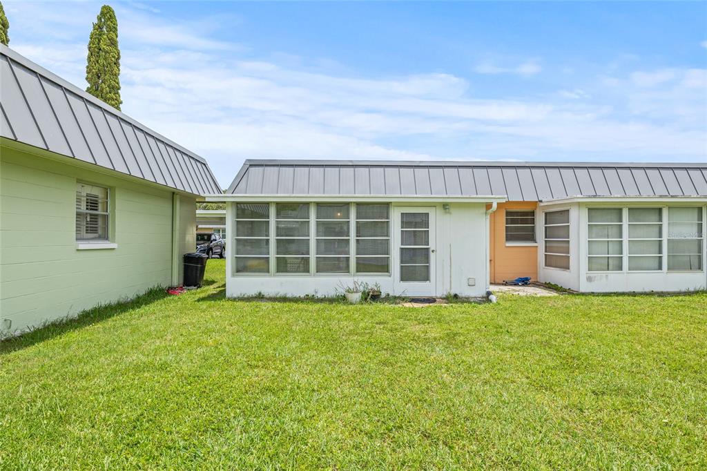 11923 Boynton Lane, Unit B New Port Richey, FL 34654 - Photo 27 of 34 a view of a house with a garden