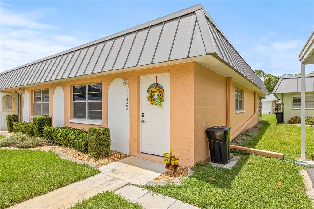 11923 Boynton Lane, Unit B New Port Richey, FL 34654 - Photo 29 of 34 a view of a house with backyard