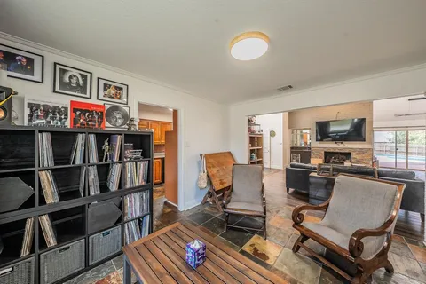 a living room with furniture cabinets and window