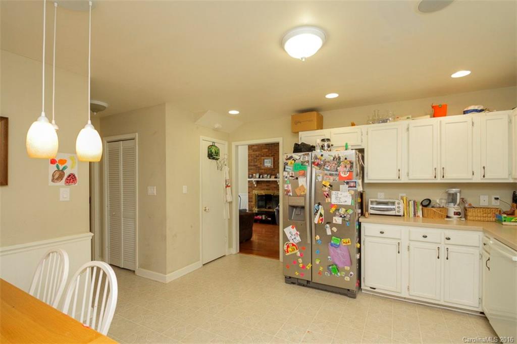10212 Sardis Oaks Road Charlotte, NC 28270 - Photo 11 of 24 a view of a kitchen with fridge and workspace