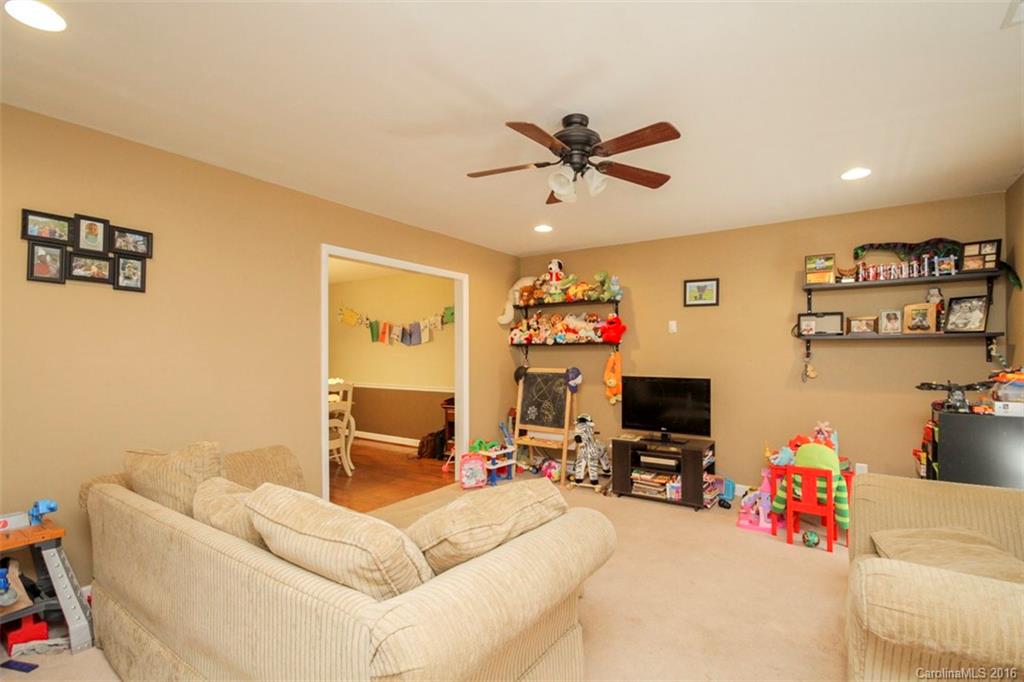 10212 Sardis Oaks Road Charlotte, NC 28270 - Photo 14 of 24 a living room with furniture and a flat screen tv