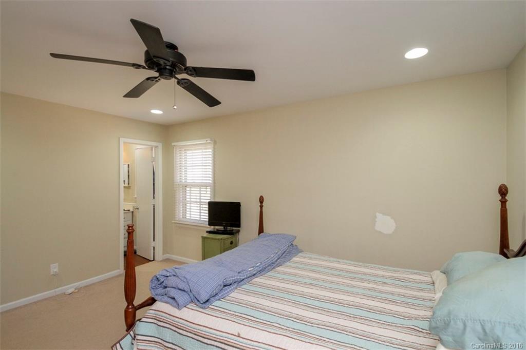 10212 Sardis Oaks Road Charlotte, NC 28270 - Photo 17 of 24 a bedroom with a bed and a tv