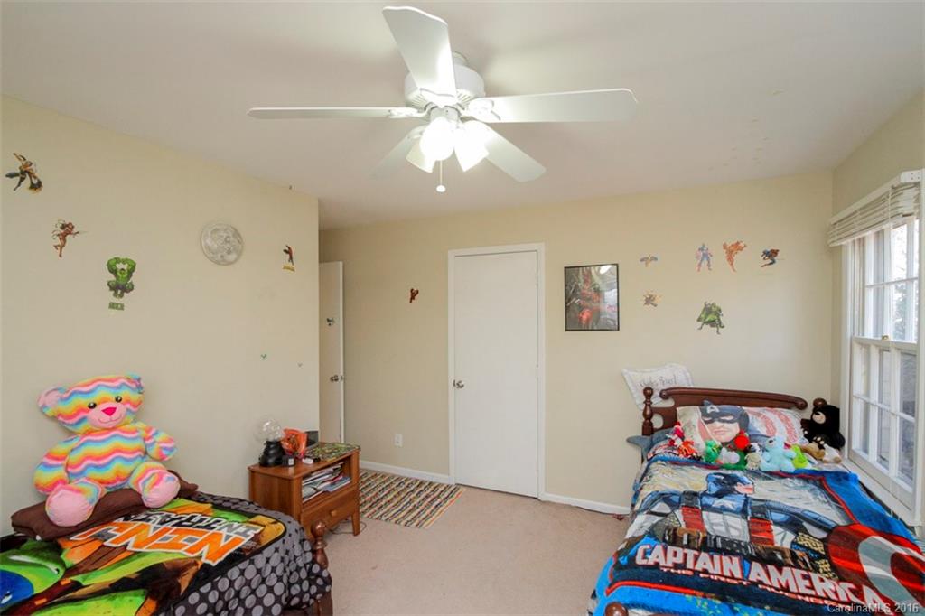 10212 Sardis Oaks Road Charlotte, NC 28270 - Photo 20 of 24 a play room with toys and a couch
