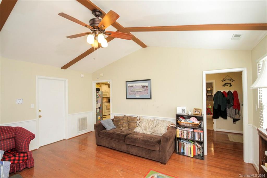 10212 Sardis Oaks Road Charlotte, NC 28270 - Photo 5 of 24 a living room with furniture and a wooden floor