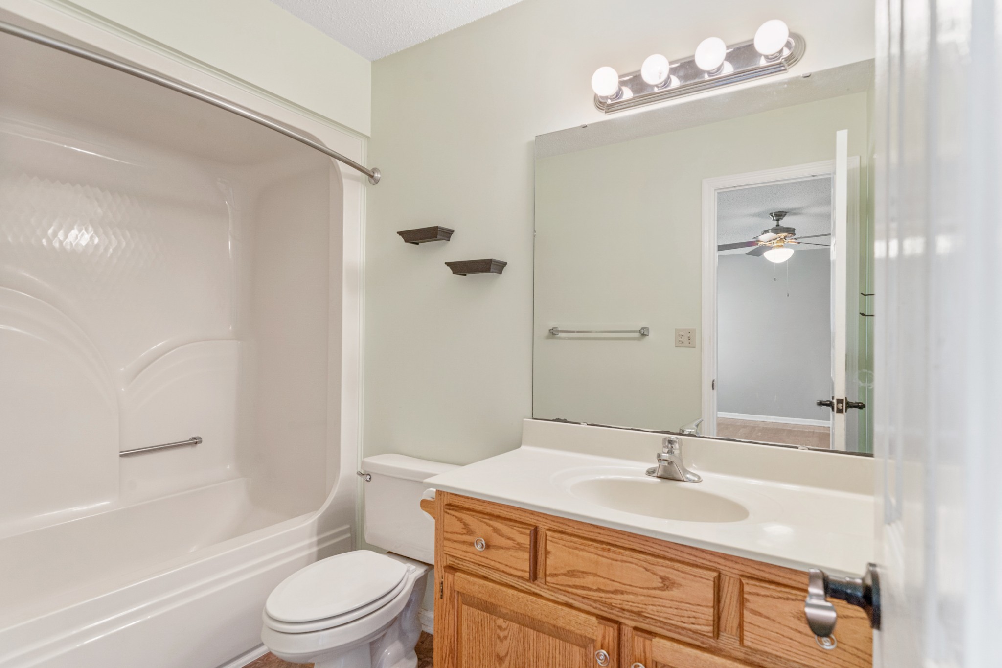 16 Town Road Fayetteville, TN 37334 - Photo 11 of 19 a bathroom with a sink a toilet a mirror and shower
