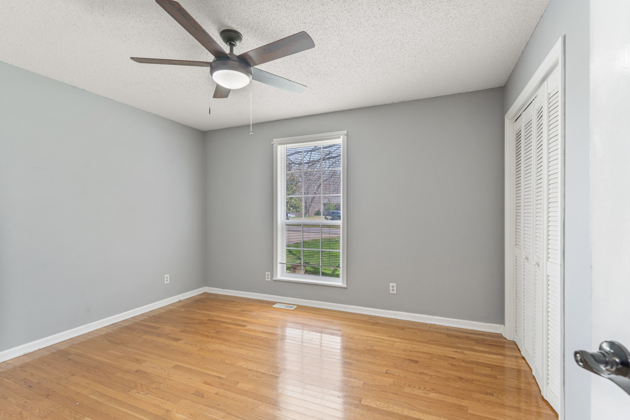 16 Town Road Fayetteville, TN 37334 - Photo 12 of 19 wooden floor in an empty room with a window