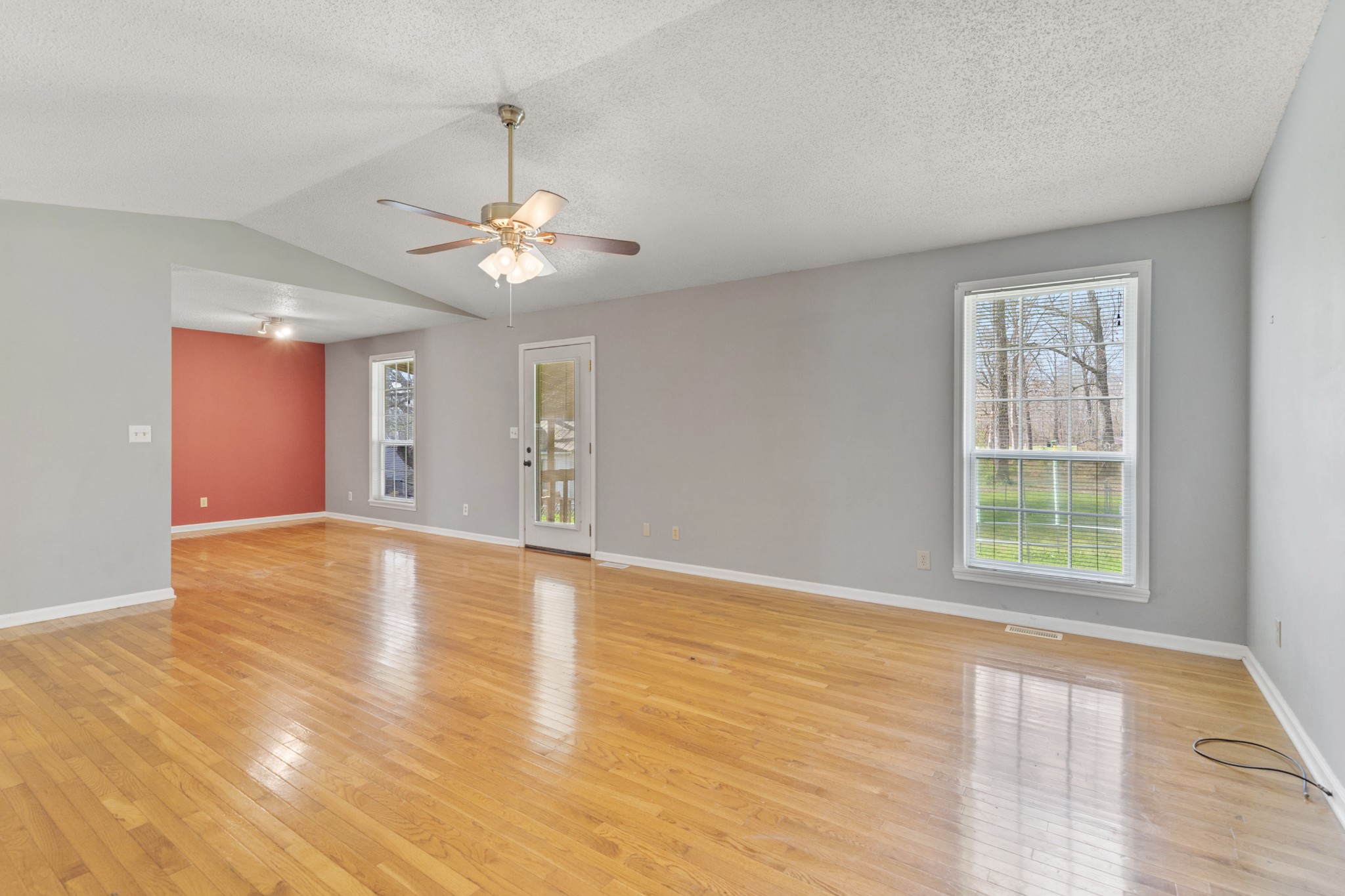 16 Town Road Fayetteville, TN 37334 - Photo 5 of 19 a view of an empty room with a window and wooden floor