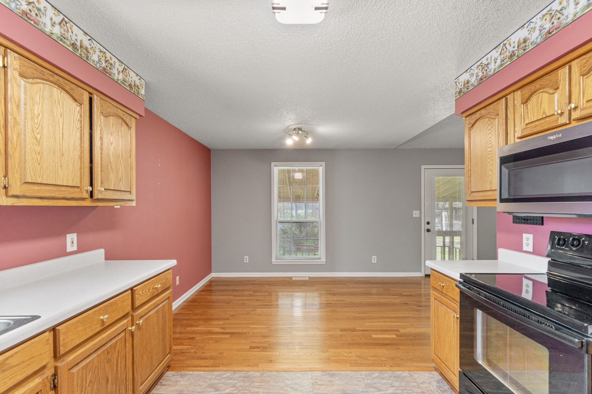 16 Town Road Fayetteville, TN 37334 - Photo 7 of 19 a view of an empty room with window and wooden floor