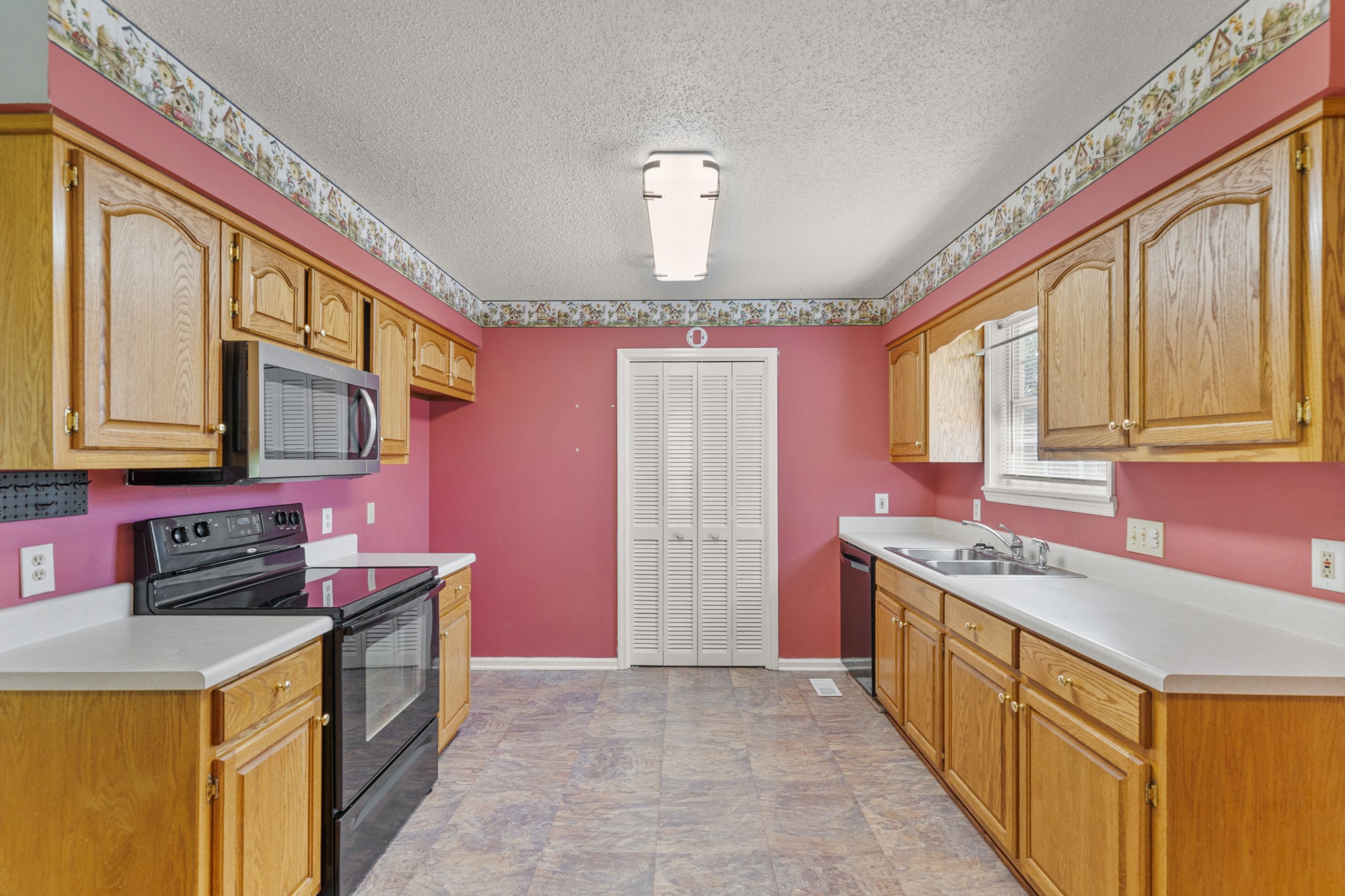16 Town Road Fayetteville, TN 37334 - Photo 8 of 19 a kitchen with stainless steel appliances granite countertop a stove a sink dishwasher and a refrigerator