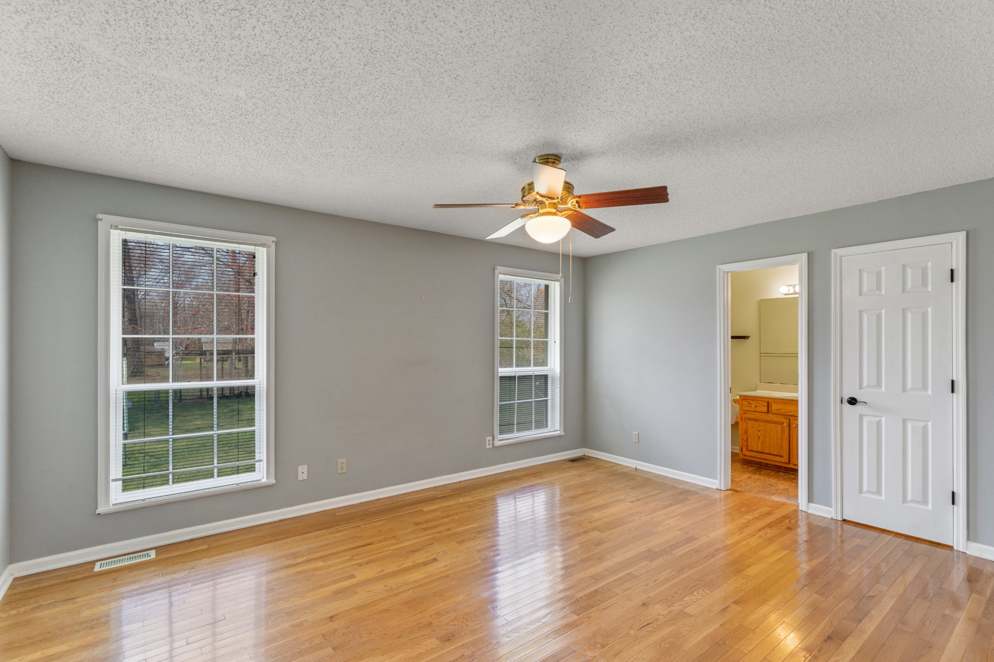 16 Town Road Fayetteville, TN 37334 - Photo 9 of 19 an empty room with wooden floor and windows