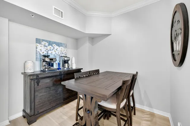 a view of a dining room with furniture and window