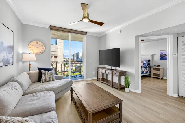 a living room with furniture and a flat screen tv