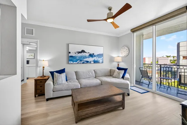 a living room with furniture and a lamp