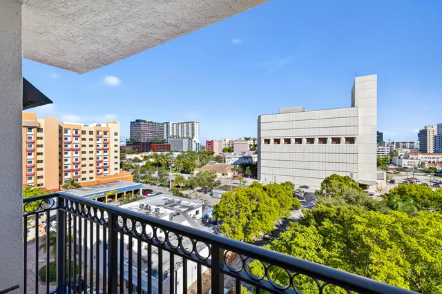 a view of a balcony with chairs
