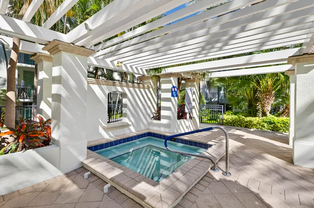 a view of a patio with a table and chairs
