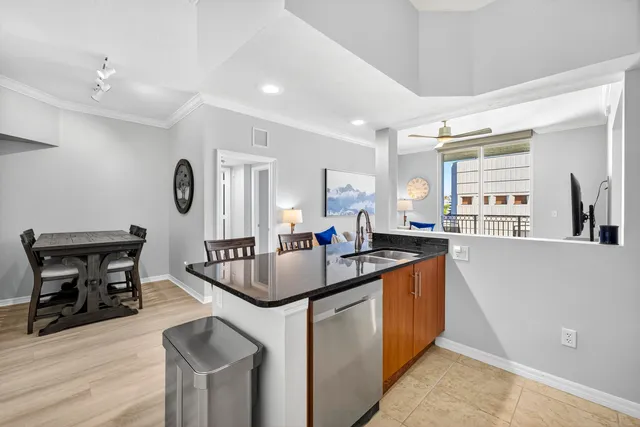 a kitchen with stainless steel appliances granite countertop a stove and a sink