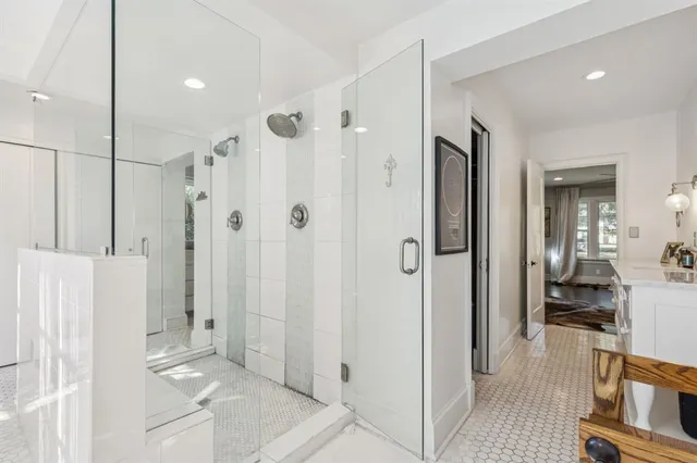 a bathroom with a shower and a sink