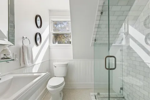 a bathroom with a toilet sink and tub