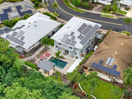 an aerial view of residential house with outdoor space and street view