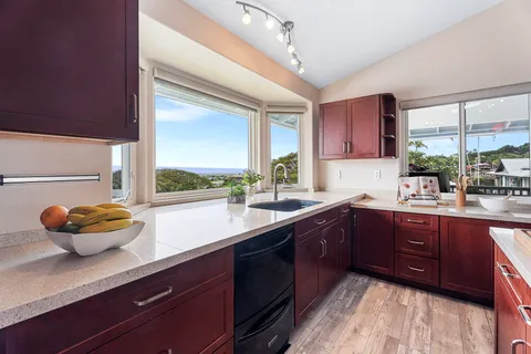 a kitchen with a sink cabinets and window