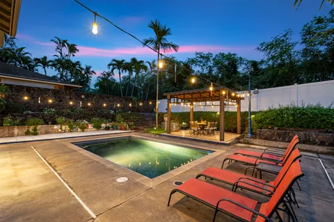 a view of swimming pool with a patio