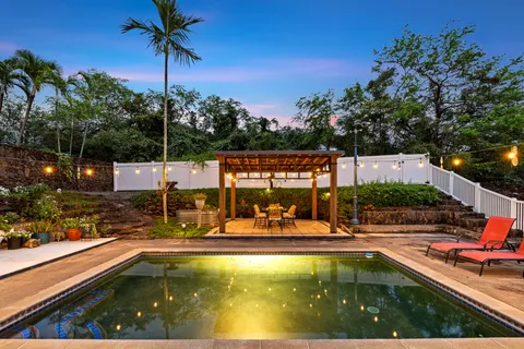a view of a swimming pool with a patio