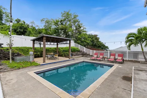 a view of a backyard with sitting area