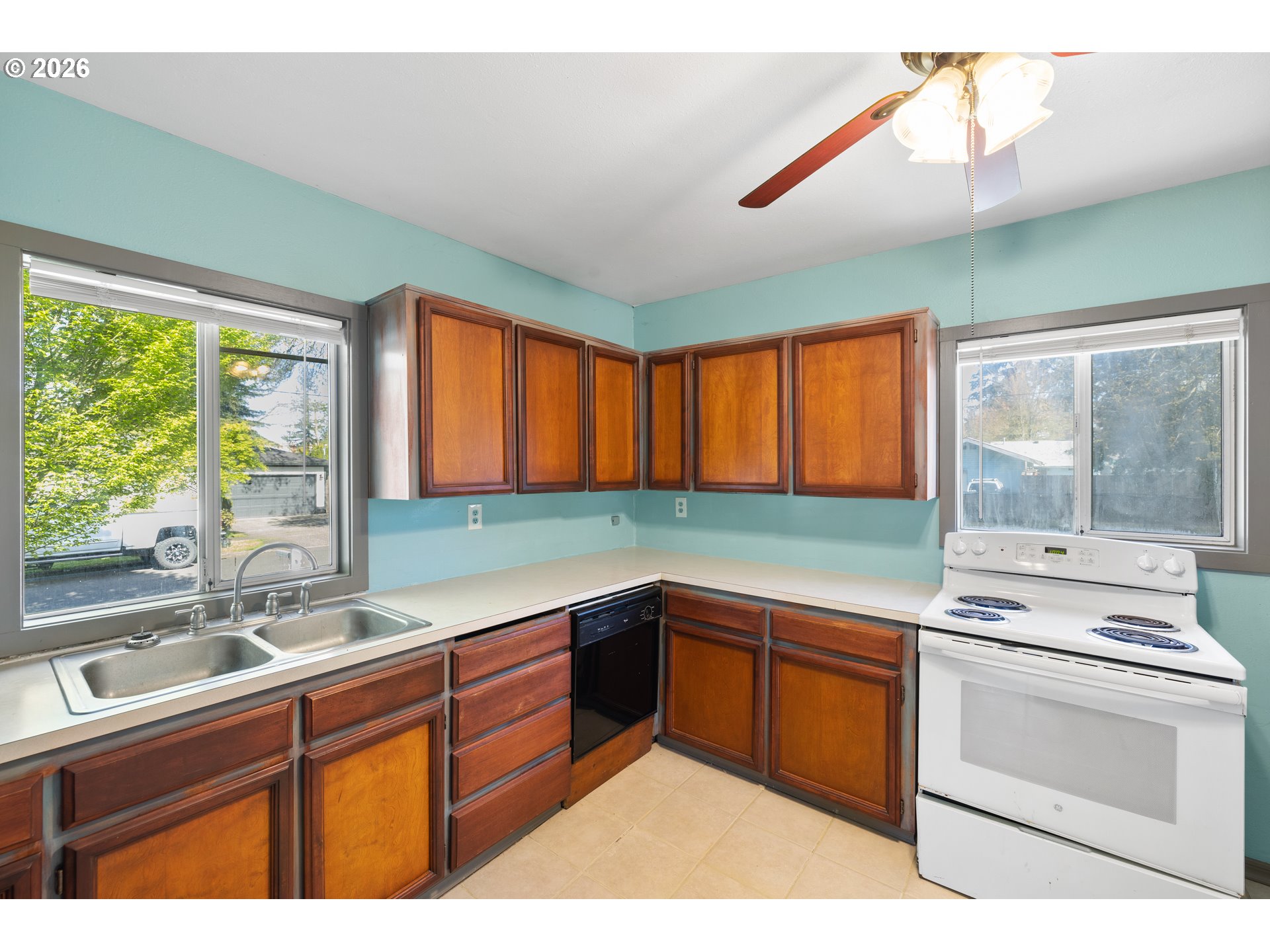 1115 Shipping Street Northeast Salem, OR 97301 - Photo 12 of 24 a kitchen with a sink cabinets and window