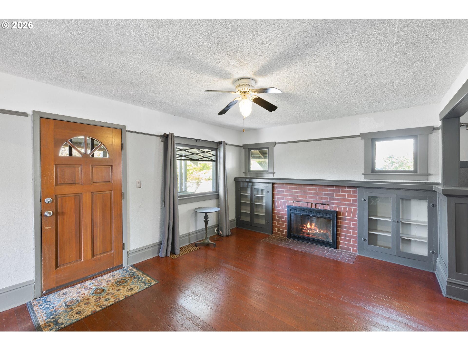 1115 Shipping Street Northeast Salem, OR 97301 - Photo 8 of 24 a living room with furniture and a fireplace