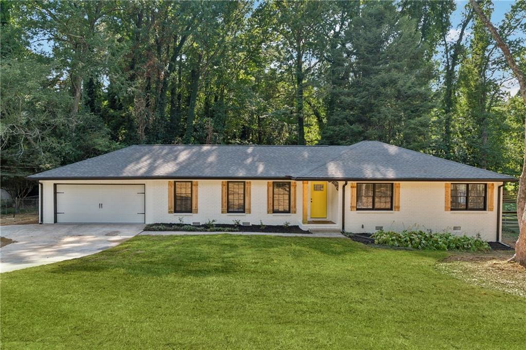 front view of a house with a yard