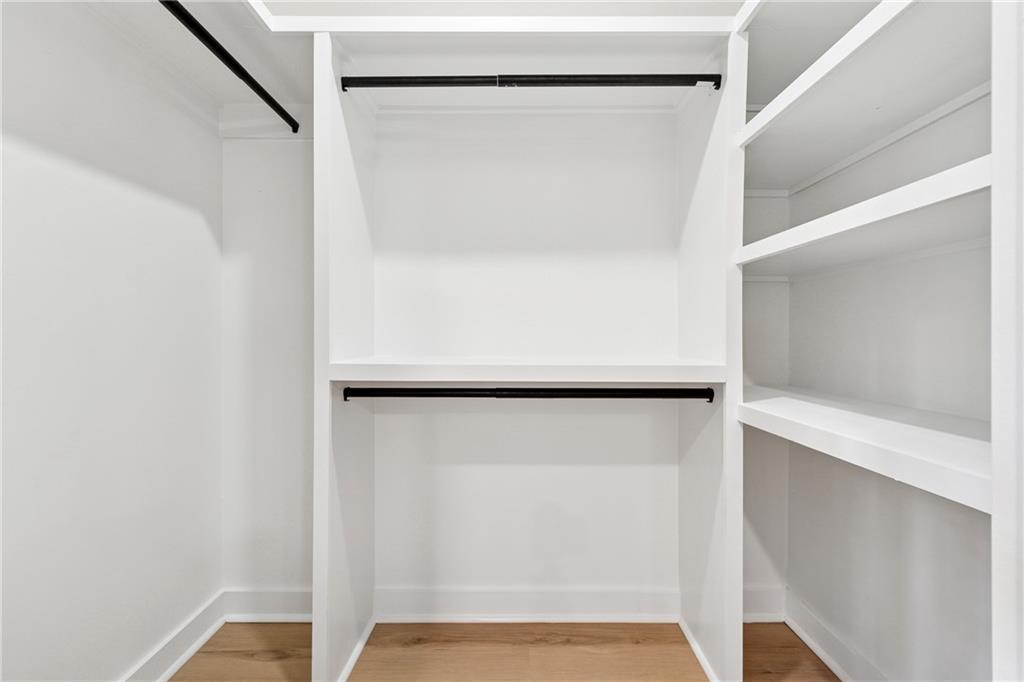 2055 Oak Road Southwest Snellville, GA 30078 - Photo 17 of 33 a view of walk in closet with empty racks