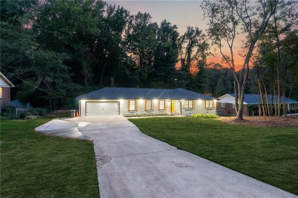 2055 Oak Road Southwest Snellville, GA 30078 - Photo 2 of 33 a view of a yard with plants and trees