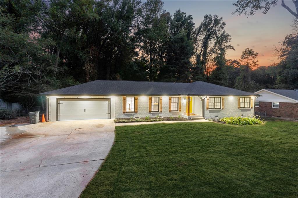2055 Oak Road Southwest Snellville, GA 30078 - Photo 29 of 33 a front view of a house with a yard