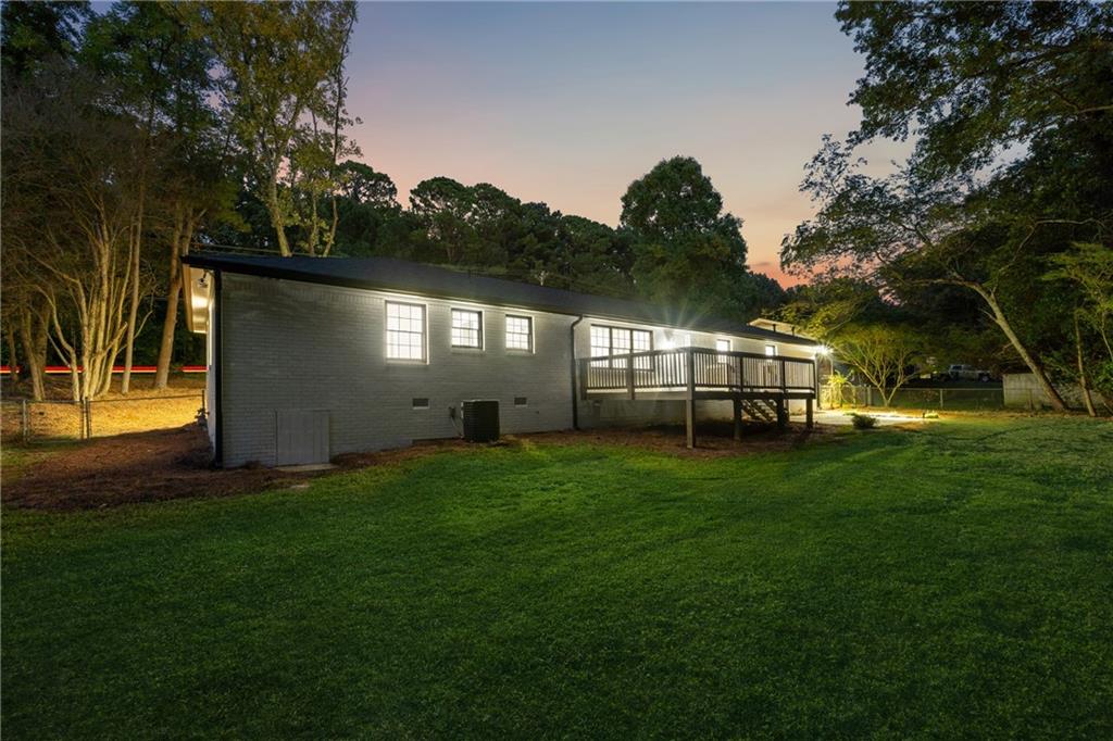 2055 Oak Road Southwest Snellville, GA 30078 - Photo 32 of 33 a view of house with backyard